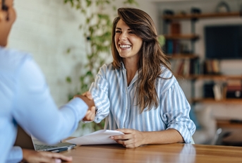 happy woman getting hired for the job