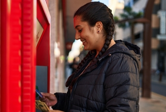 Woman using an ATM
