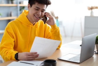 A young virtual assistant on the phone with their client