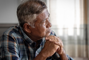 old man thinking about something seriously