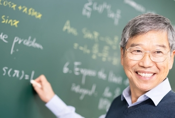 happy senior asian professor teaching calculus in classroom