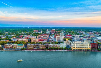 aerial shot of savannah with skylines and homes