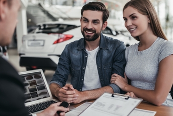 couple at car dealership