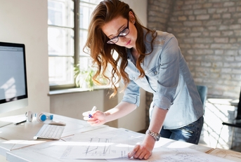 young female architect working on project