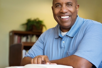 middle age student working in library