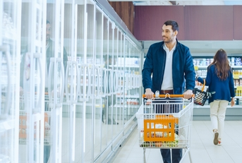 Man pushes shopping cart