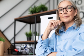 senior businesswoman looks seriously at the camera