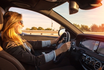 beautiful business woman driving car