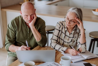 senior couple stressing about budget