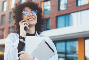Smiling woman talking on phone