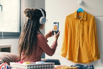 woman taking pictures of her clothes 