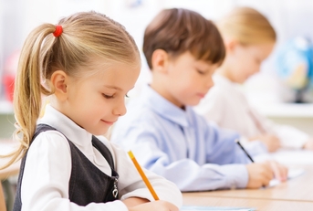 pupils are writing in their copybooks