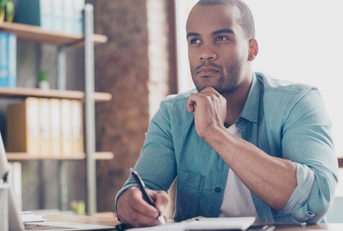 student is making decision sitting at the office 