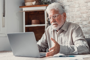 worried senior man unable to make utility bill