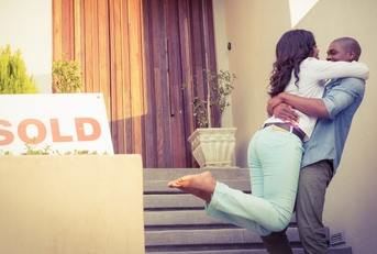 happy couple after buying new house
