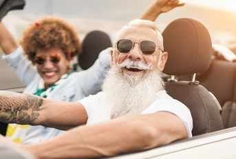 senior multiracial couple having fun on road trip
