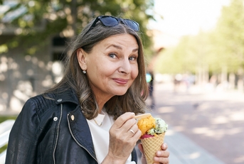 woman eating multi-flavoured icecream.