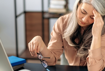 tired mature businesswoman