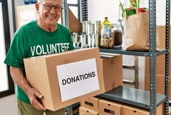 senior man wearing volunteer uniform