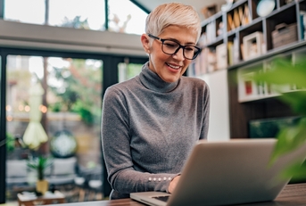 Mature businesswoman working on laptop