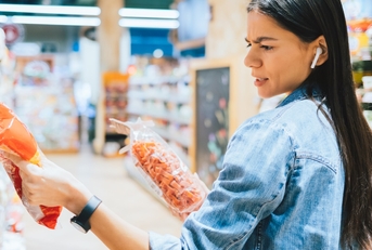 woman shopping for snacks at store