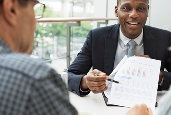 A financial advisor is offering advice to a couple