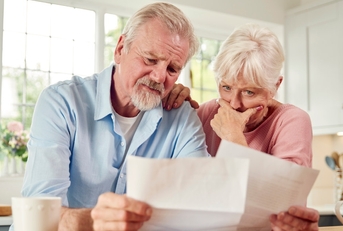 senior  couple reviewing bills