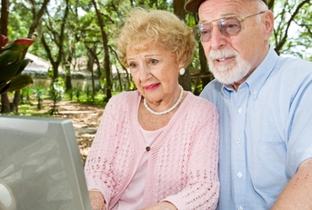 senior couple on laptop