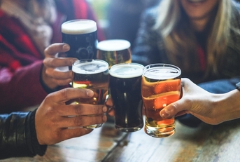 friends drinking and toasting beer