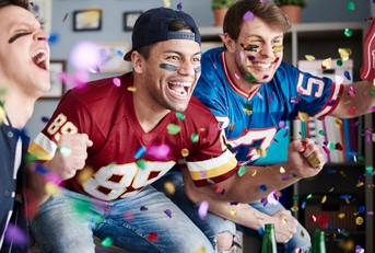 american football players celebrating with confetti