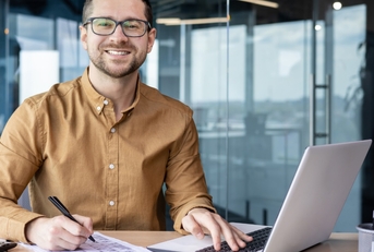 young businessman smiling at office