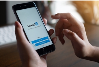 man checking linkedin app