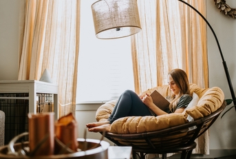 woman reading at home