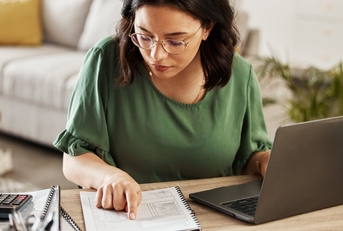 woman with laptop in home office