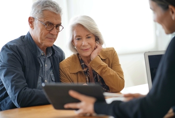 senior couple remodeling ideas on tablet