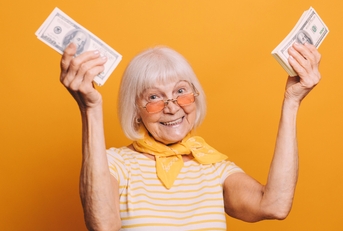 raises hands and holds money