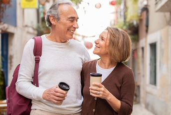 walking with backpack drinking coffee