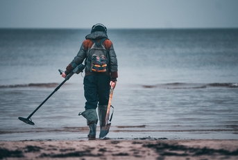 metal detector on sandy beach