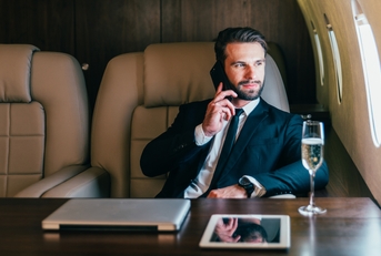 businessman flying on his private jet