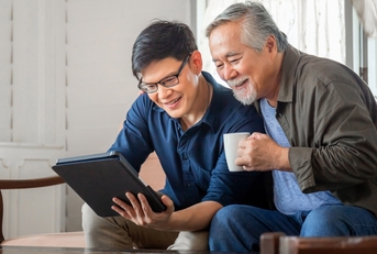 adult son using tablet smartphone