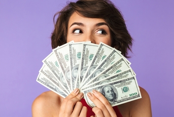 covering face with money