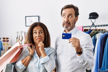 couple holding shopping bags