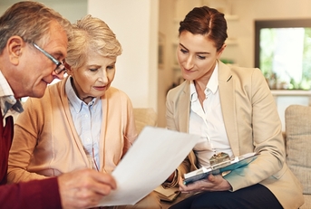 senior couple and financial advisor