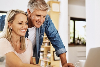 mature couple researches at home