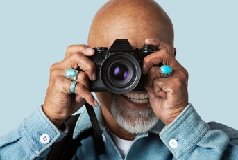 senior man with a digital camera