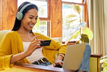 woman shopping online using card