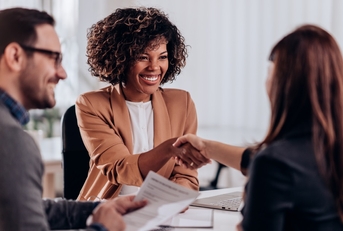 managers congratulating candidate at interview