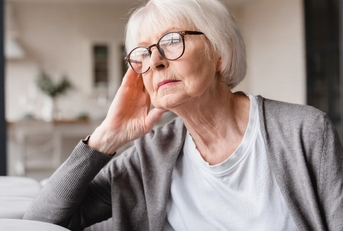grandmother sitting on the sofa couch