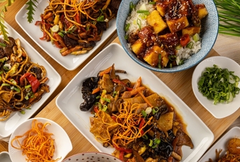 delicious chinese food on wooden table