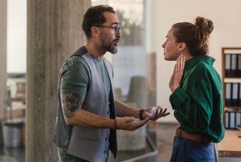 colleagues arguing in office